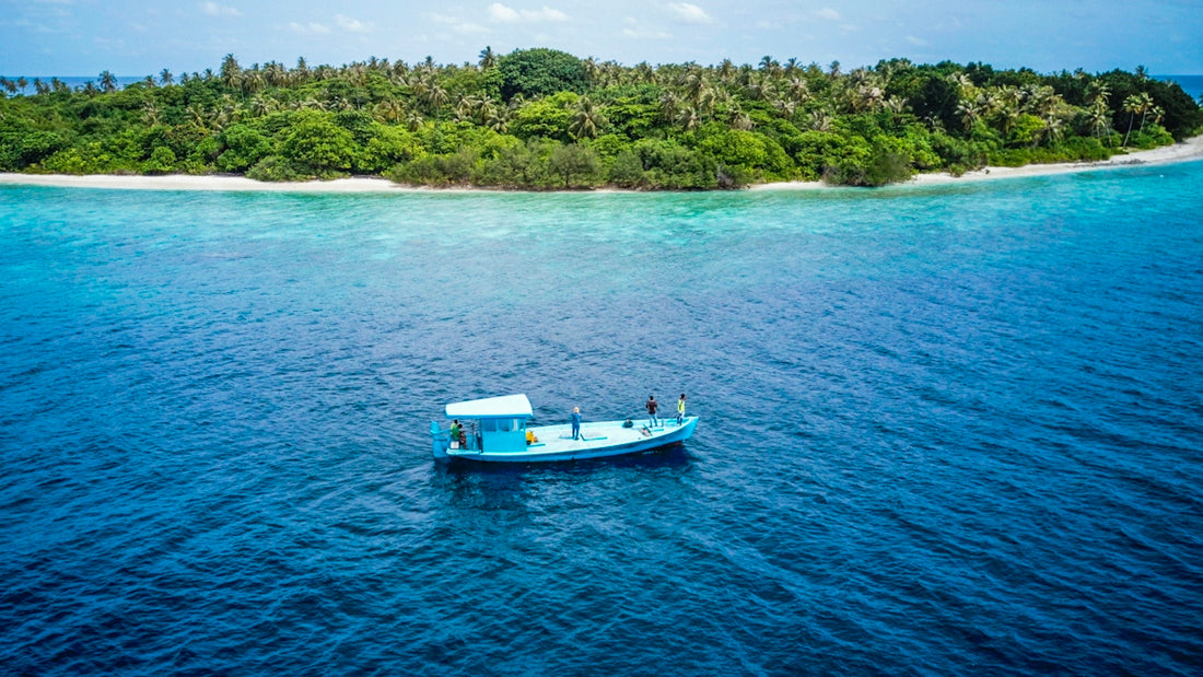 white boat on body of water during daytime