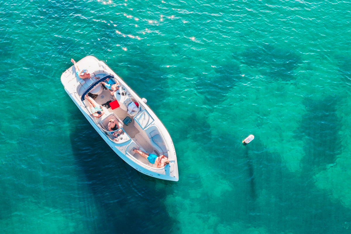 people on white boat