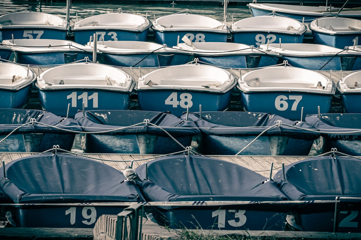 blue and white boats on dock during daytime