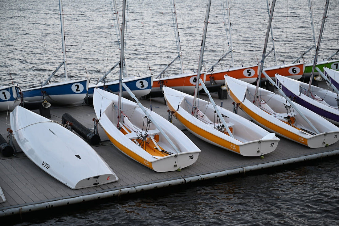 a group of boats sit on a dock