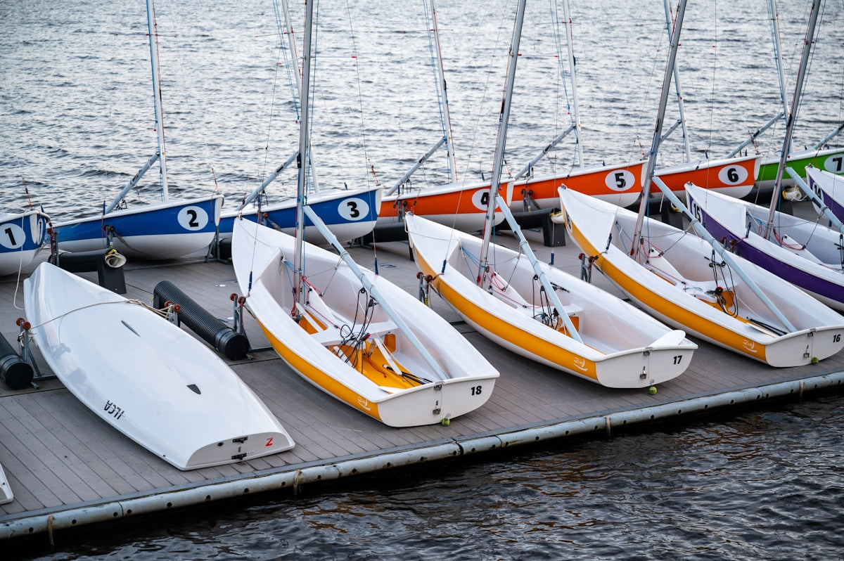a group of boats sit on the water