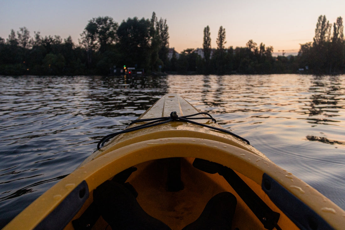 a person in a yellow kayak