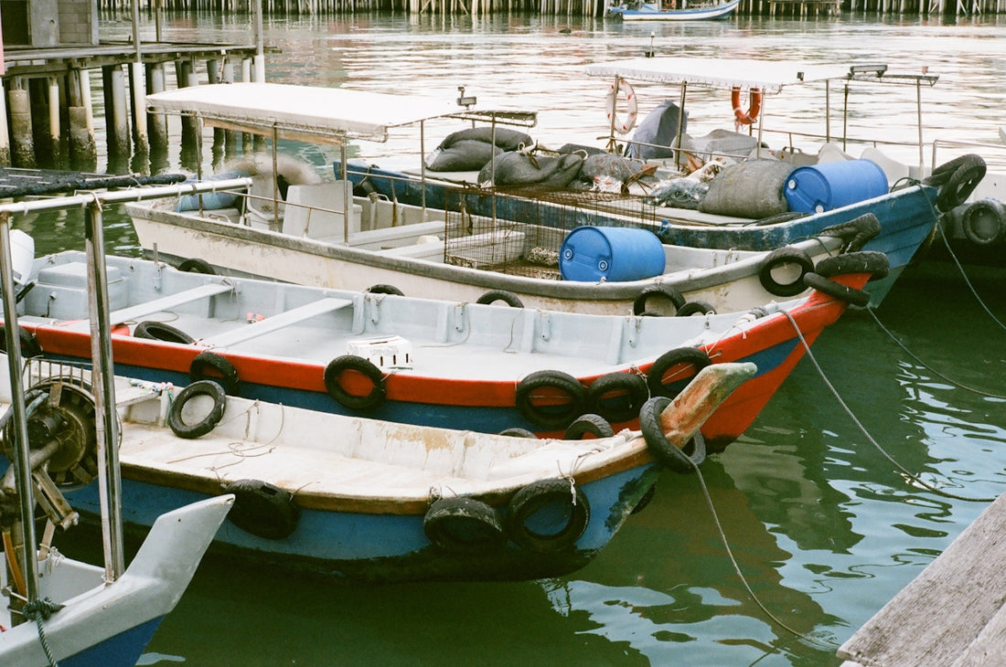 a couple of boats that are sitting in the water