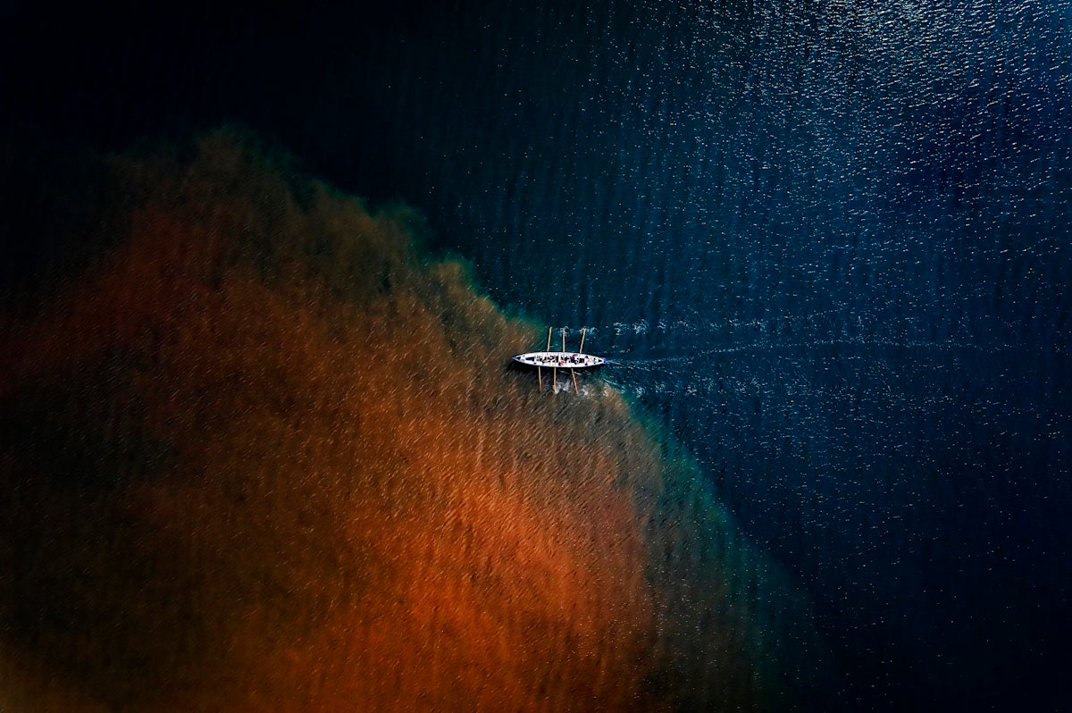 a boat floating on top of a body of water