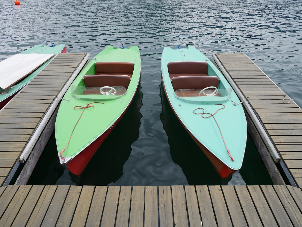 A couple of boats that are sitting in the water