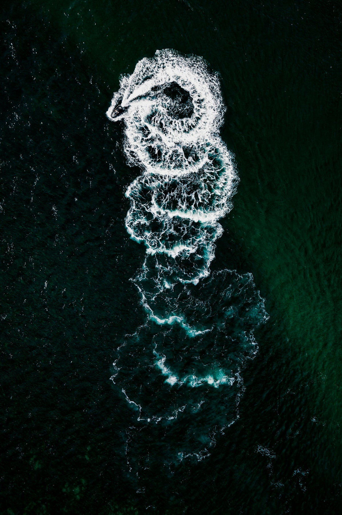 An aerial view of a boat in the water