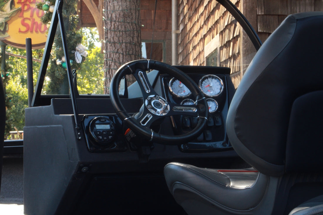 Boat helm and dashboard with gauges and steering wheel