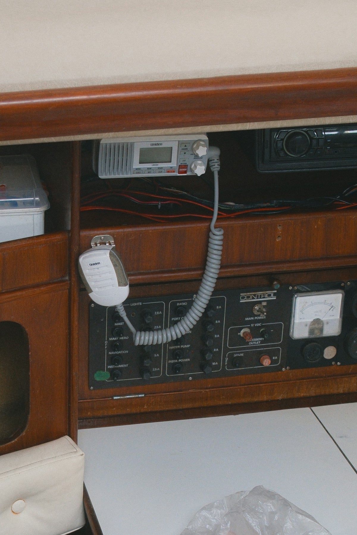 Marine radio equipment mounted on wooden panel